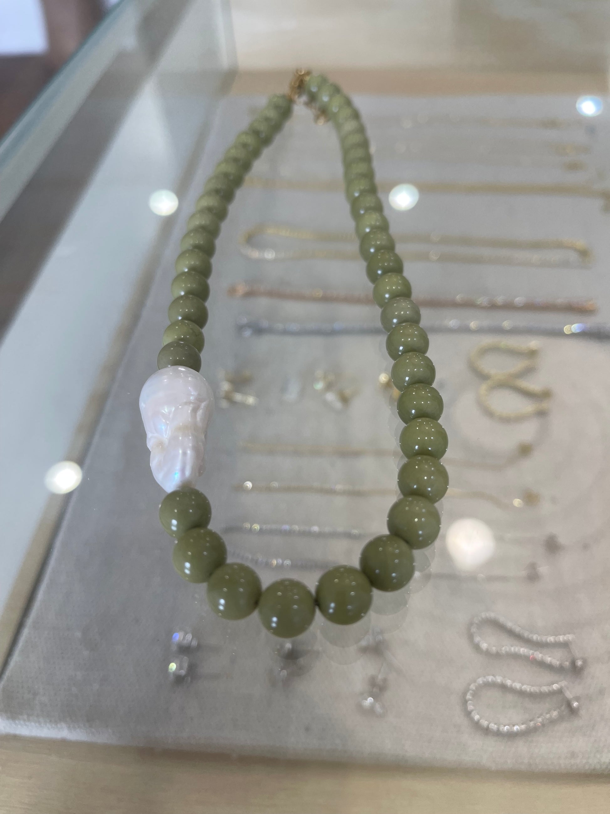 Florentine beaded necklace with fresh water pearl , close up.