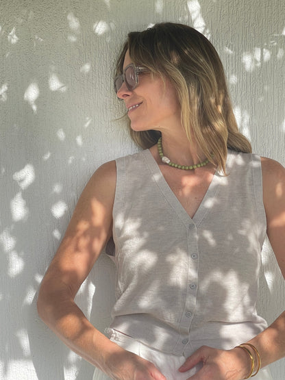 Hand made beaded necklace featuring a fresh water pearl with an organic shape




